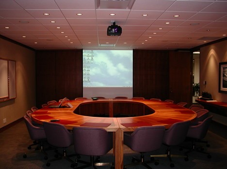 Boardroom with Crestron control system allowing for control of all audio video components within the room